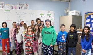 SOMS students standing in line, wearing pajamas