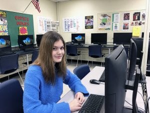 Student seated in computer lab