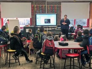 Principal speaks with students about bus safety