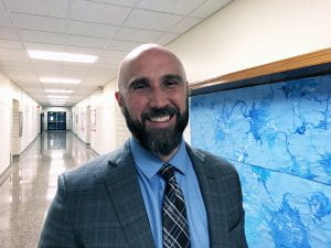 Rudy Arietta, incoming TZHS principal, smiling in hallway