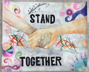 Poster of clasped hands with text "Stand Together"
