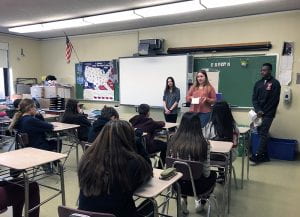 Three ninth-graders speak to a class of eighth-graders at SOMS
