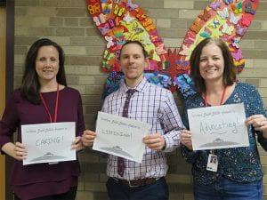 School Counselors holding up signs for National School Counseling Week