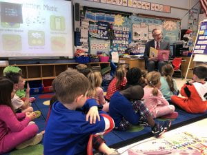 Superintendent Robert Pritchard reads to kindergartners
