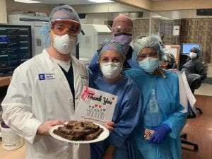 Healthcare workers with brownies and thank-you note
