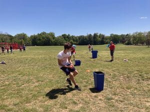 Middle school student competes in sponge soaker challenge at Field Day