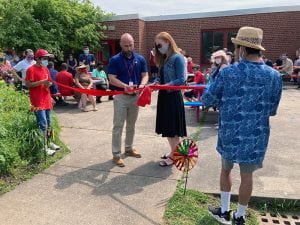 Principal Rudy Arietta helps cut ribbon on rededicated COVE Garden