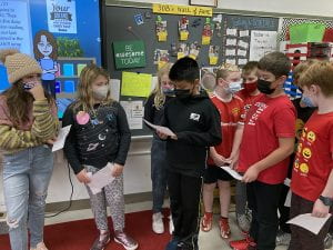 Fifth-graders consulting on character ed assembly
