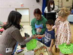 TZHS Students Help WOS Students at Holiday Shop
