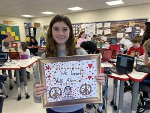 Student with finished artwork inspired by Martin Luther King