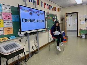 7th Grader presents during Spanish Publishing Party