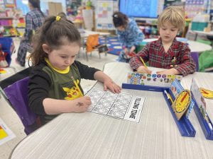 Grade 1 class practices telling time